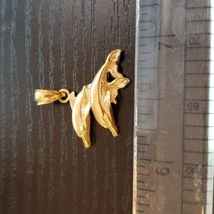 14K gold pair of dolphins pendant.